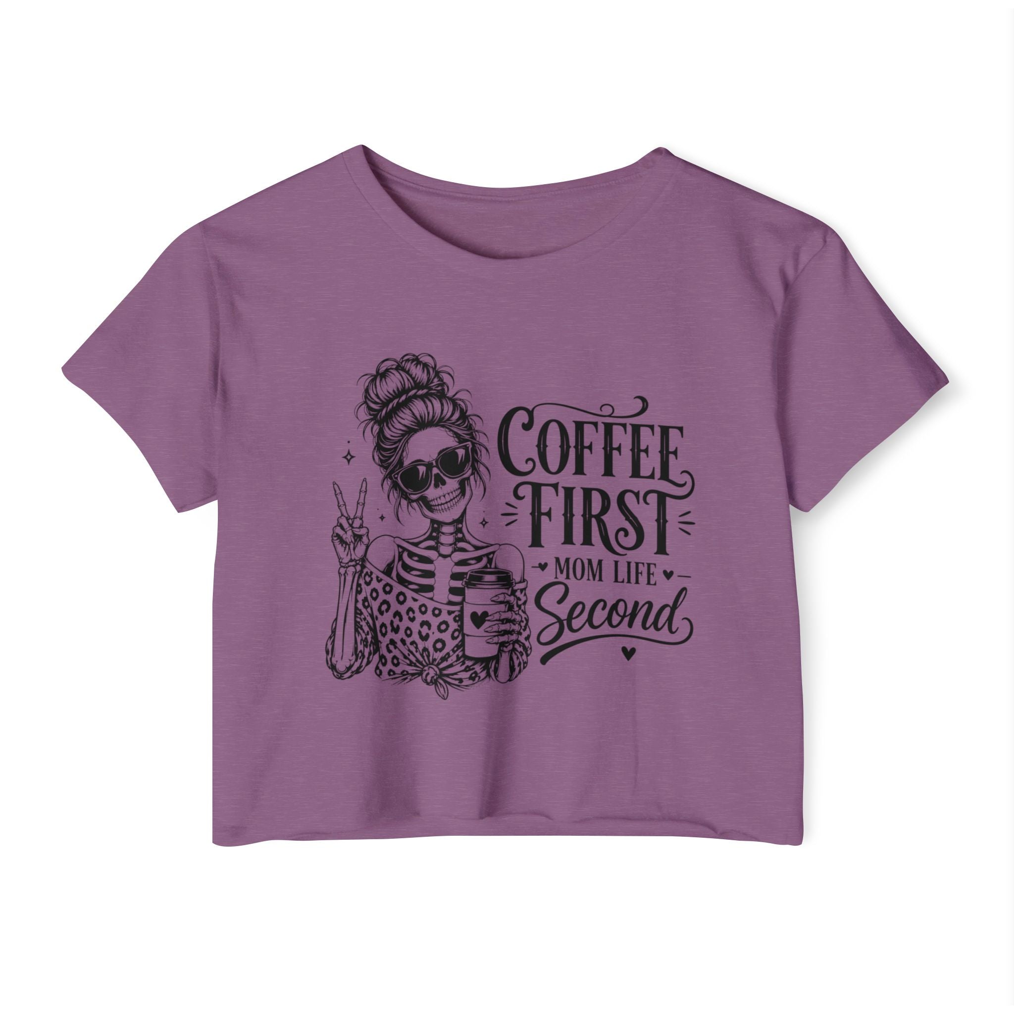 Purple t-shirt with skeleton design and text 'Coffee First, Mom Life Second' on a white background