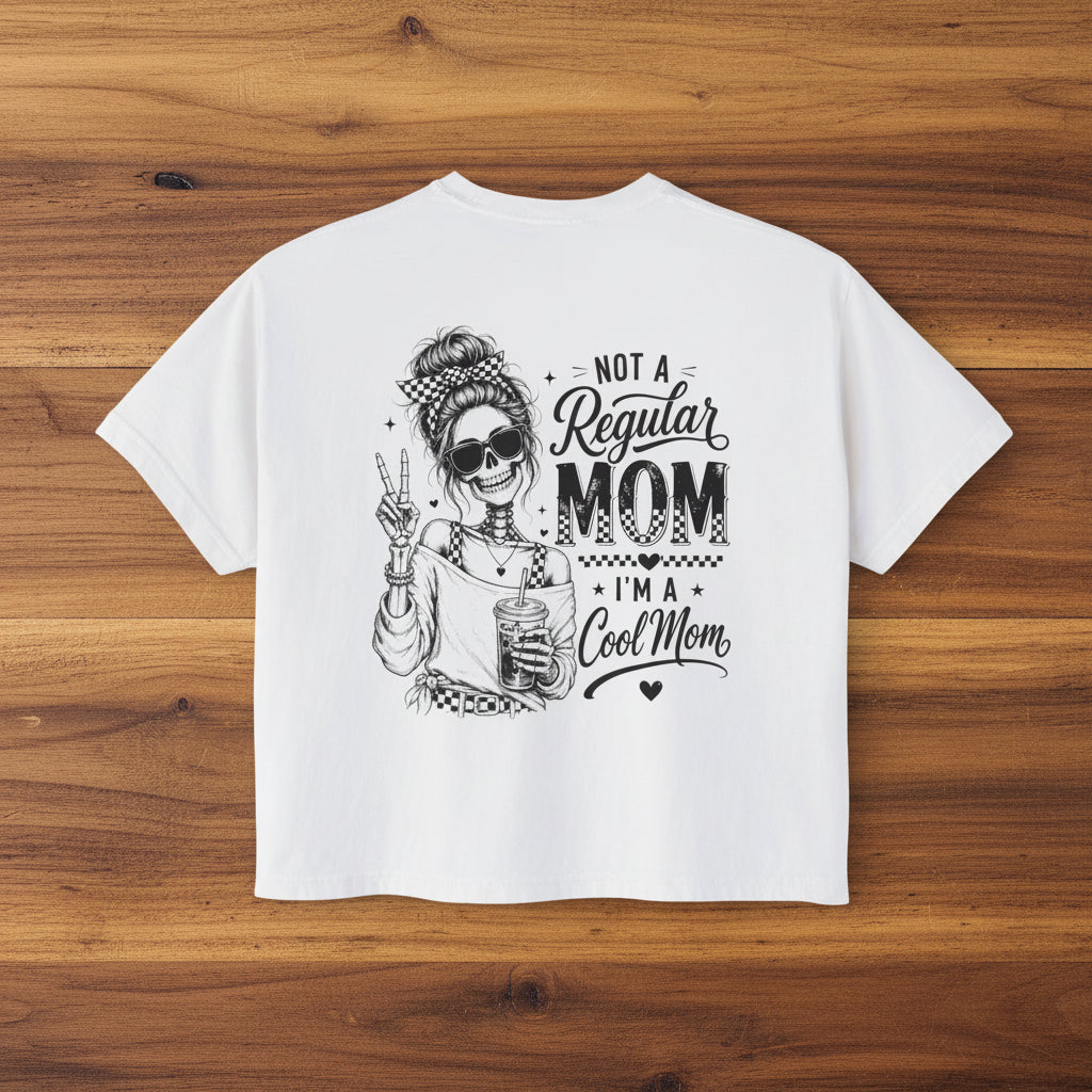 Women’s white boxy cropped tee with black Cool Mom skeleton coffee graphic on the back.