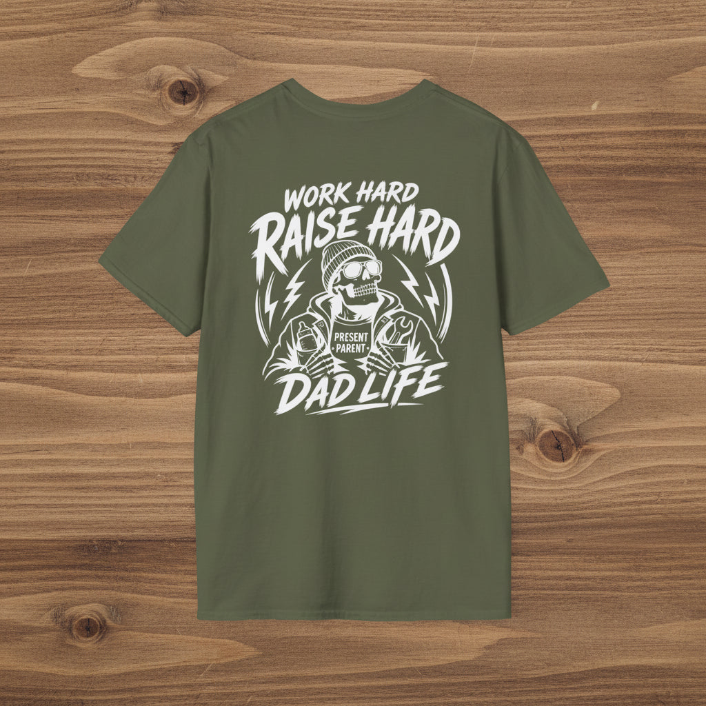 Military green Work Hard Raise Harder t-shirt with white dad life graphic on a woodgrain background.