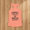 Peach Coffee Mom racerback tank top with black Coffee First Mom Life Second text on a woodgrain background.