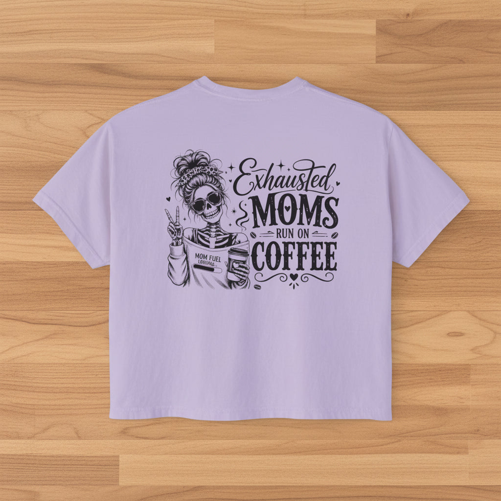 Lavender women’s boxy cropped tee with black Exhausted Moms Run On Coffee graphic on the back.