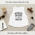 White Motherhood Has No Days Off crop tank with black mom life graphic on a beige background.