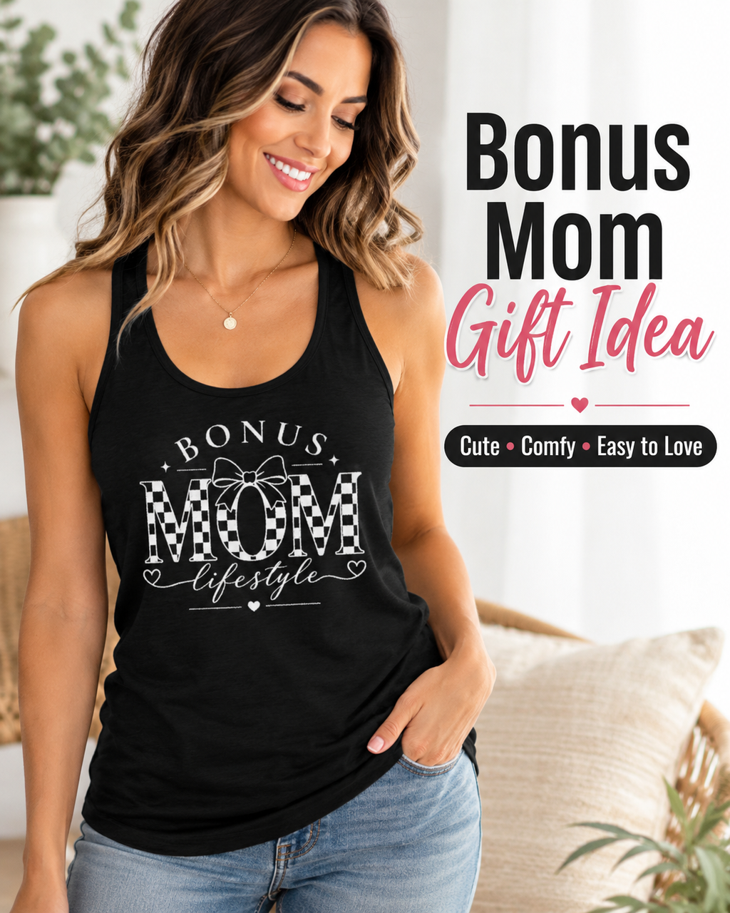Woman wearing a black tank top with 'Bonus Mom' text, sitting on a couch.