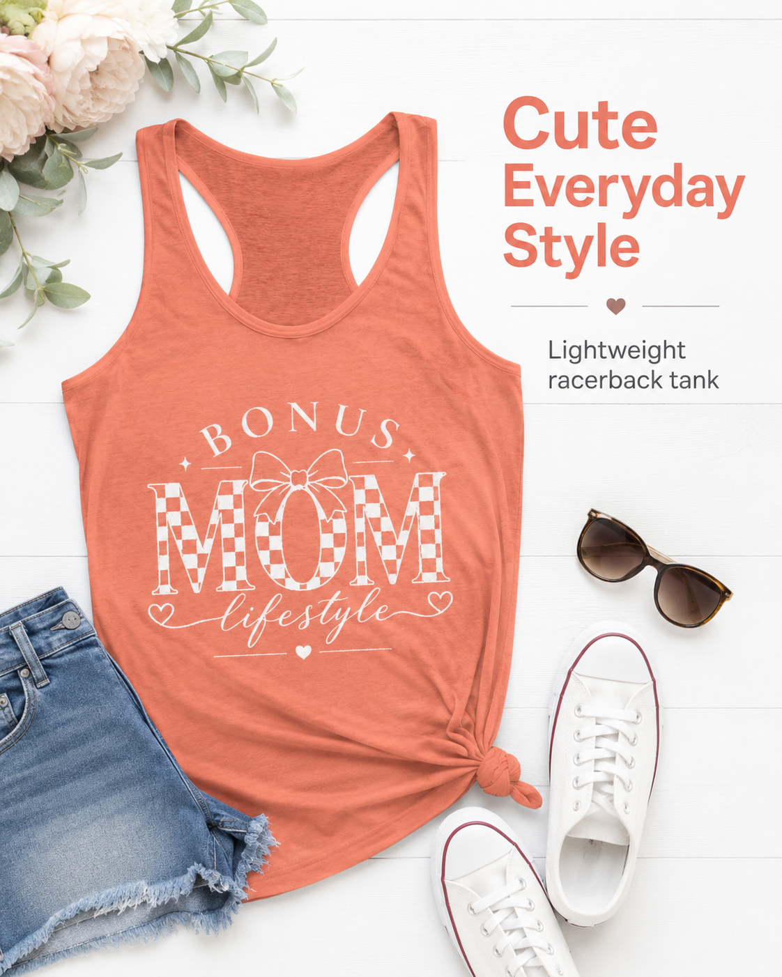 Coral tank top with 'Bonus Mom Lifestyle' text, sunglasses, denim shorts, and white sneakers on a white background.