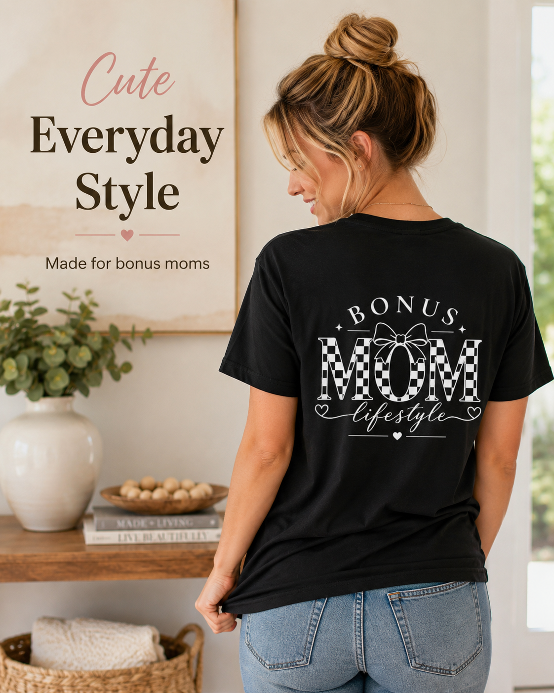Woman wearing a black t-shirt with 'Bonus Mom Lifestyle' text in a home setting.