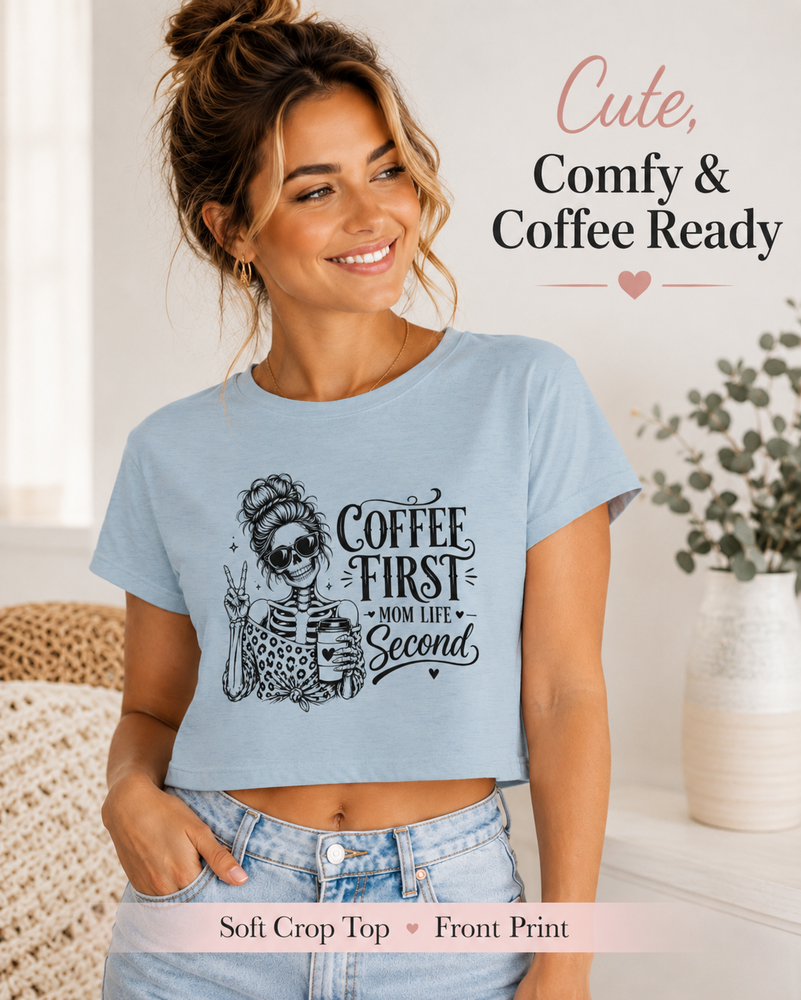 Woman wearing a light blue t-shirt with a skeleton design and text, standing in a home setting.