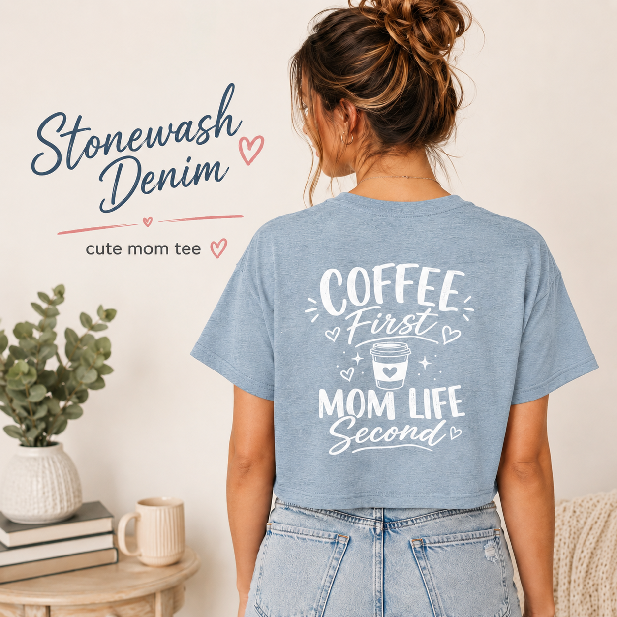 Stonewash denim Coffee First Mom Life Second women’s crop top modeled from the back with light wash jeans, showing a trendy blue casual shirt with white coffee graphic print. Cute coffee lover top for moms, wives, girlfriends, new mom gifts, weekend errands, coffee shop outfits, vacation wear, and laid-back caffeine style.