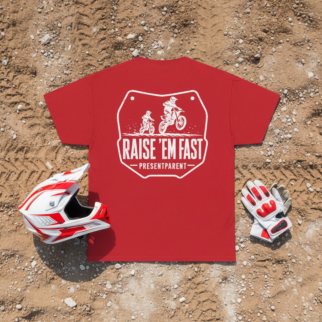 Red men’s dirtbike dad t-shirt with white Raise ’Em Fast father and child motocross graphic on a dirt background.