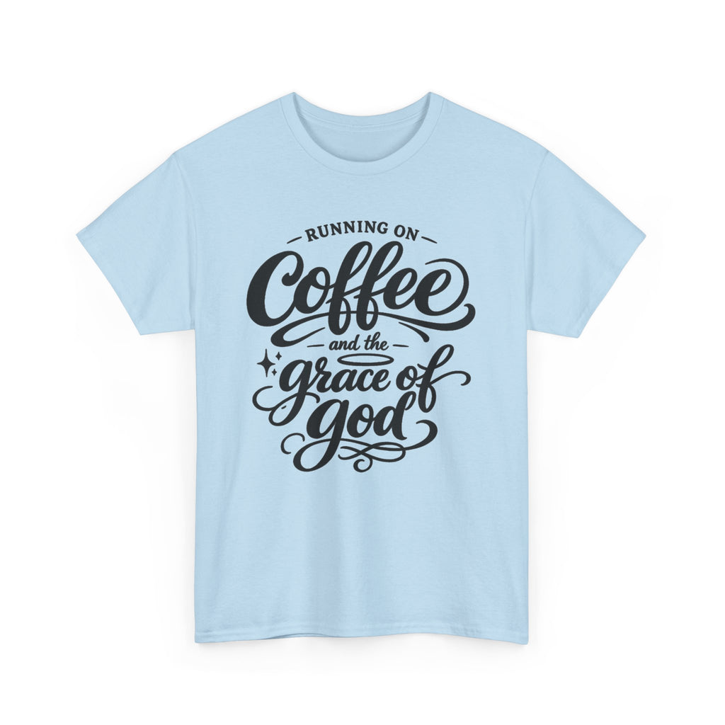 A light blue short-sleeve crewneck t-shirt with a black graphic text print reading 'RUNNING ON Coffee and the grace of god' on the front, displayed against a solid white background.