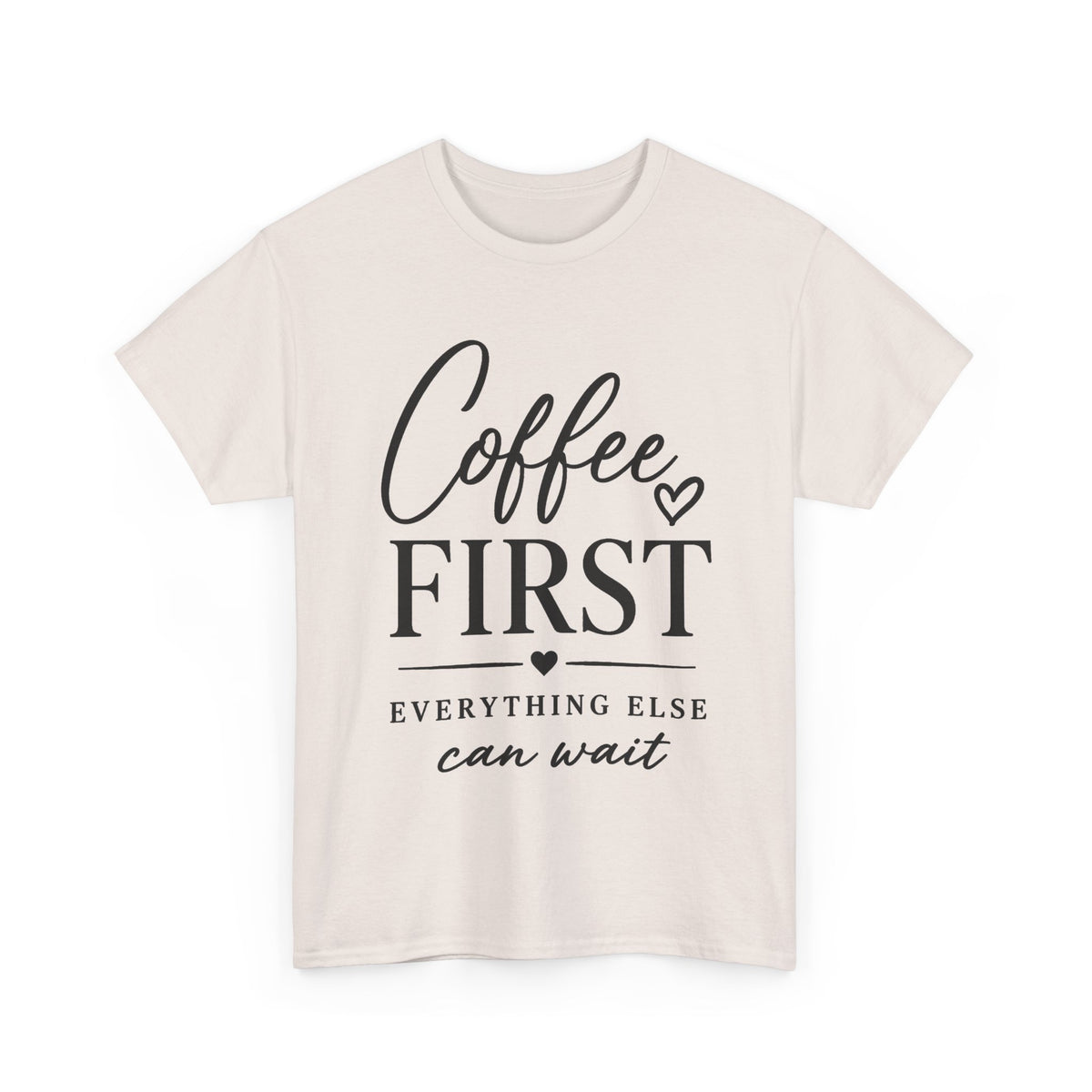 A light beige crewneck t-shirt with a black graphic print on the front that reads 'Coffee FIRST EVERYTHING ELSE can wait' with small heart accents, displayed on a clean white background.
