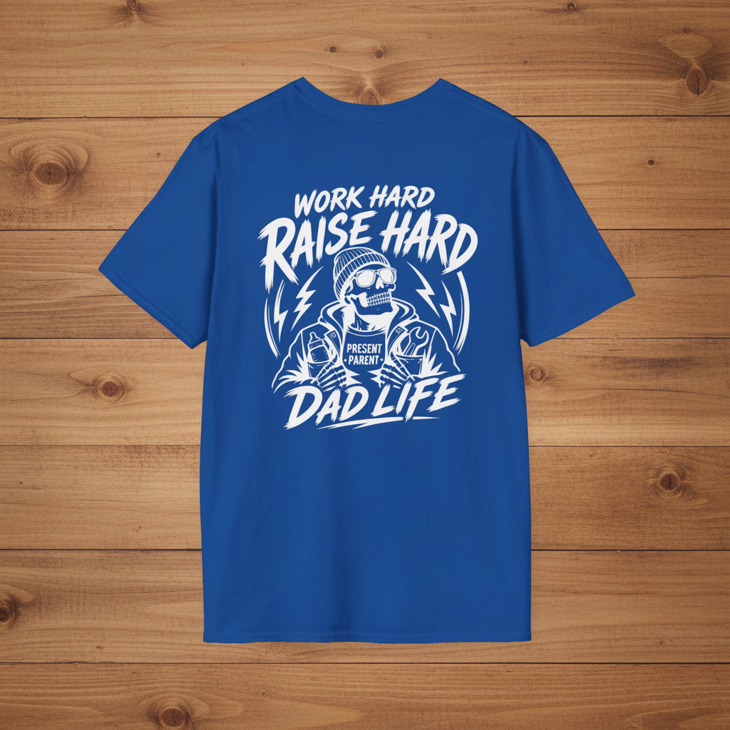 Blue Work Hard Raise Harder t-shirt with white dad life graphic on a woodgrain background.