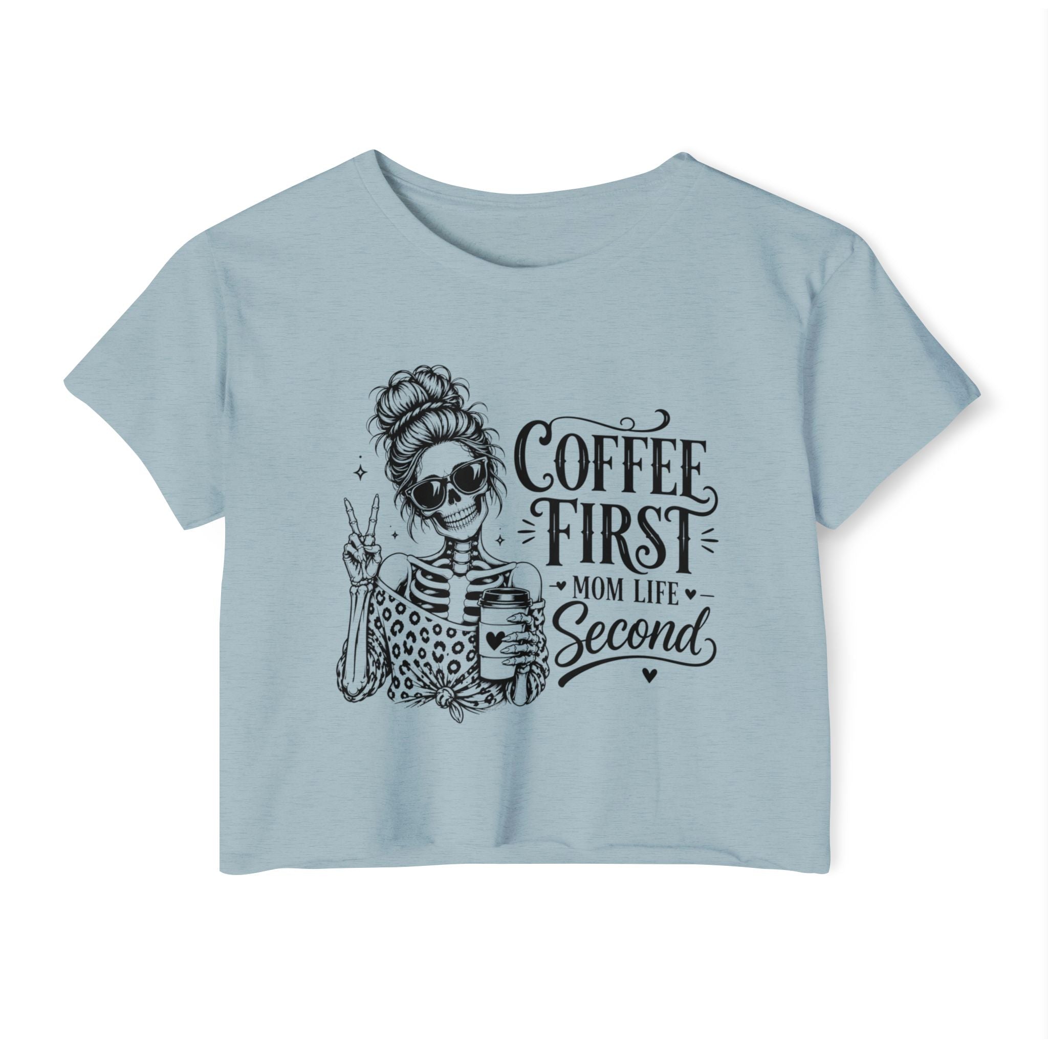 Light blue t-shirt with skeleton graphic and text 'Coffee First, Mom Life Second' on a white background