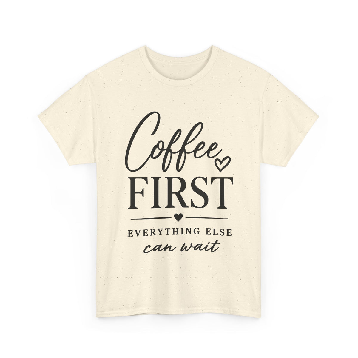 A cream-colored short-sleeve t-shirt with a black graphic print on the front that reads 'Coffee FIRST EVERYTHING ELSE can wait' with small heart accents, displayed on a clean white background.