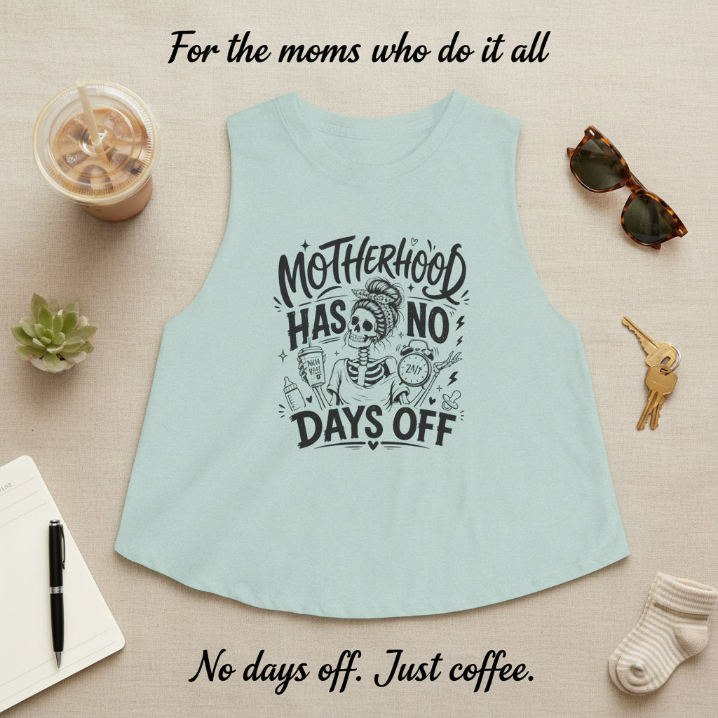 Light blue Motherhood Has No Days Off crop tank with black graphic and coffee mom message.