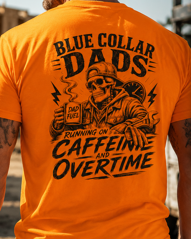 A man wearing a bright orange t-shirt, viewed from behind. The back of the shirt features a large black graphic print with the text 'BLUE COLLAR DADS' and 'RUNNING ON CAFFEINE AND OVERTIME' surrounding an illustration of a skeleton dad wearing a hard hat and holding a coffee mug.