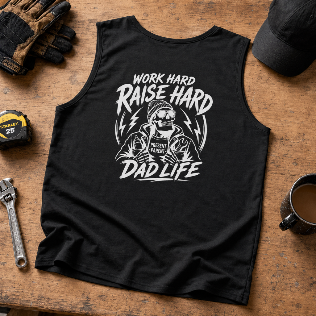 Black tank top flat lay featuring a white skull dad design and “Work Hard Raise Hard” lettering, styled as a men’s summer shirt for dad life, backyard barbecue outfits, workout clothing, tradesman gifts, and casual blue collar fashion.
