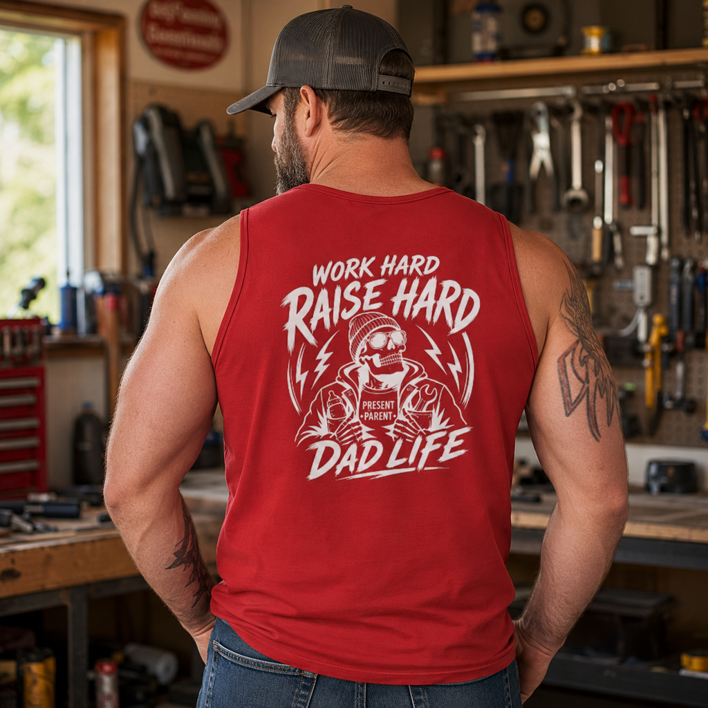 Garage lifestyle photo of a man wearing a red back print tank top, styled for hardworking dads, mechanics, blue collar husbands, father figures, weekend warriors, shop clothing, warm weather work outfits, and bold dad life apparel.