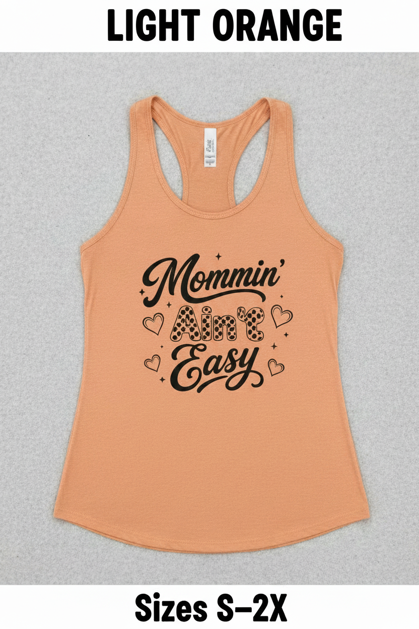 Flat lay of a light orange Mommin’ Ain’t Easy racerback tank top with black coffee mom design, cute Mother’s Day gift shirt for busy moms.