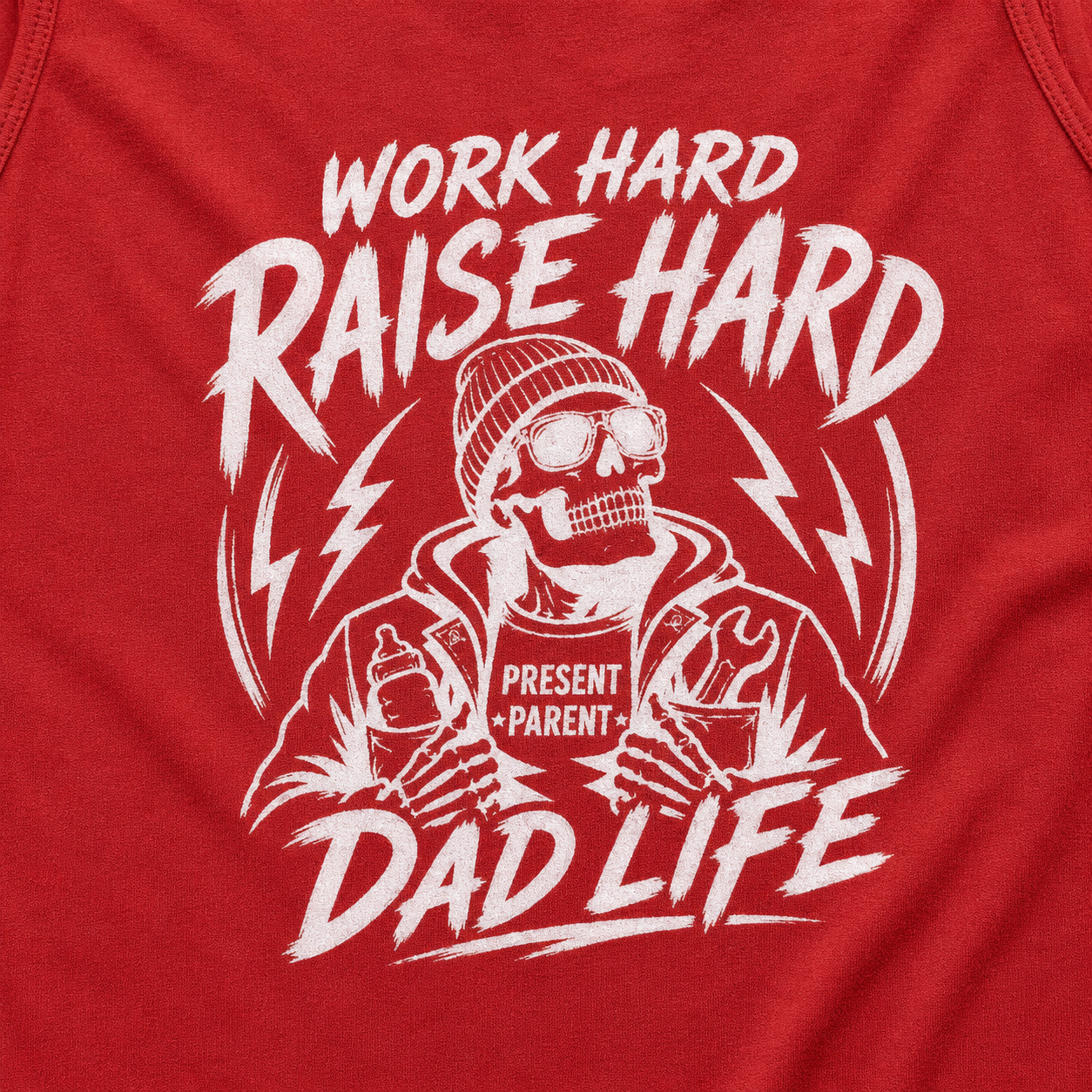 A close-up of a red tank top featuring a white graphic print of a skeleton dad wearing a beanie and goggles, with the text 'WORK HARD RAISE HARD DAD LIFE' and 'PRESENT PARENT'. Mens casual back print graphic summer tank top