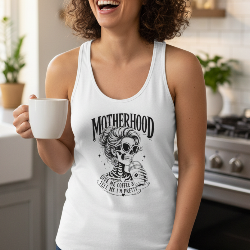 Lifestyle image of a white Coffee Mom skeleton racerback tank top, casual women’s summer outfit and funny coffee lover gift for moms.